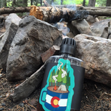 Colorado flag camp mug sticker featuring mountains and pine trees