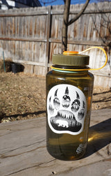Black-and-white outdoor sticker from the pack displayed on a water bottle