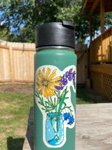 Blue mason jar bouquet sticker with lupine, bluebells and a yellow daisy