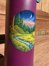 Close-up of round campfire and tent sticker on a water bottle