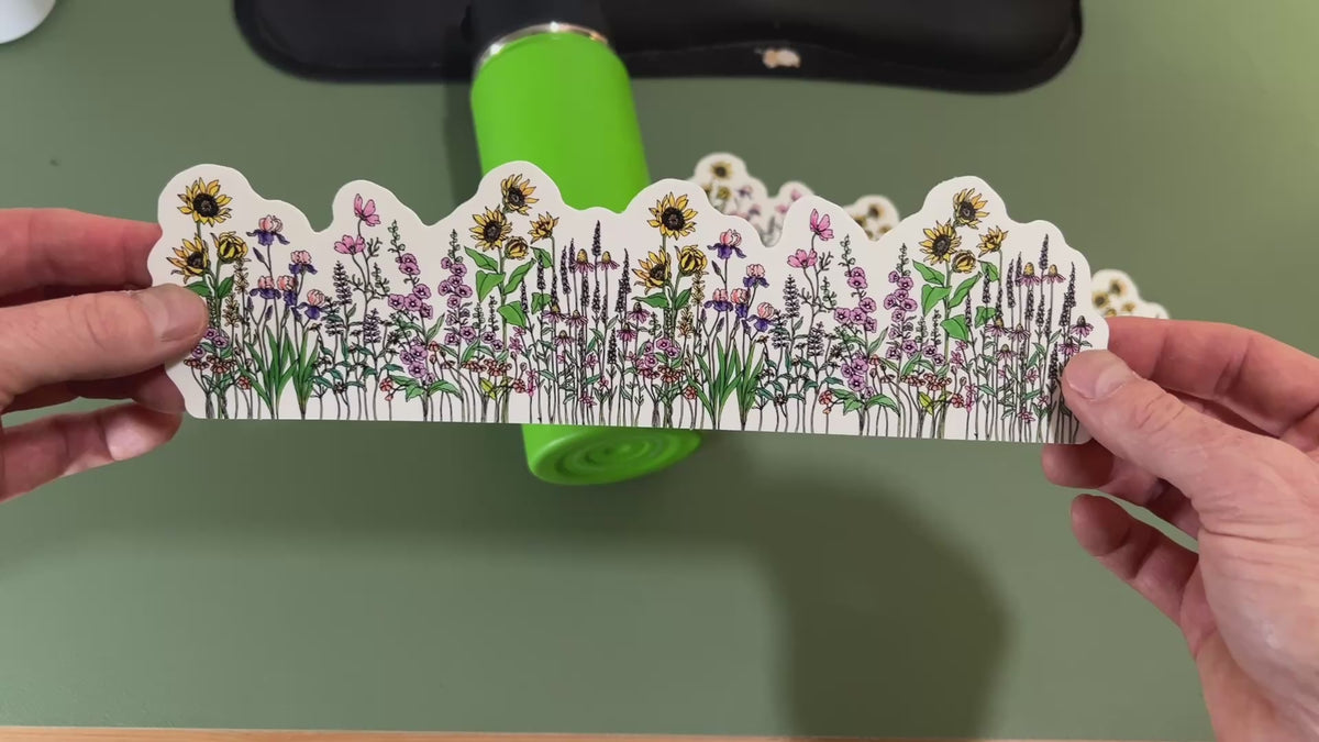 Applying a nature water bottle wrap sticker to a water bottle