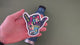 Applying the Stoked Shaka hand sticker to a water bottle