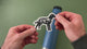 Applying the adventure dog sticker to a water bottle