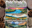 Four nature water bottle wrap stickers featuring mountains, wildflowers and a river sunset